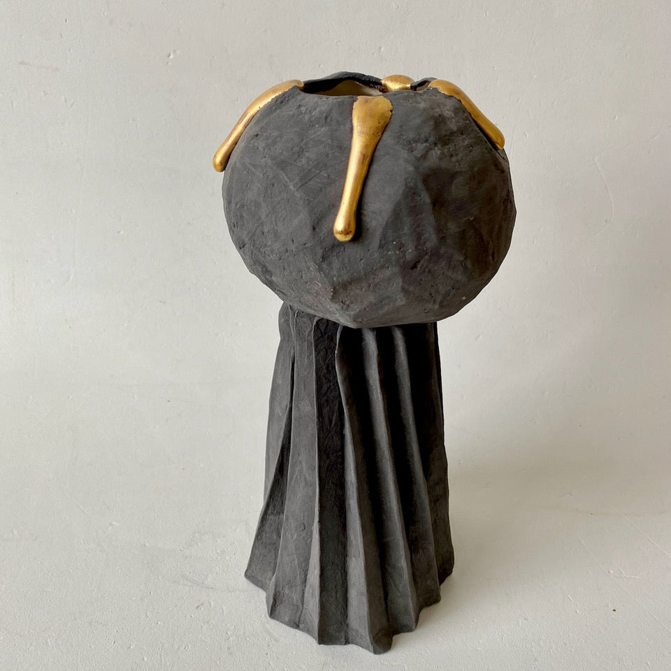 Charcoal sphere on folded base